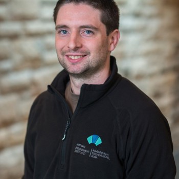 A headshot of Tiomóid Foley