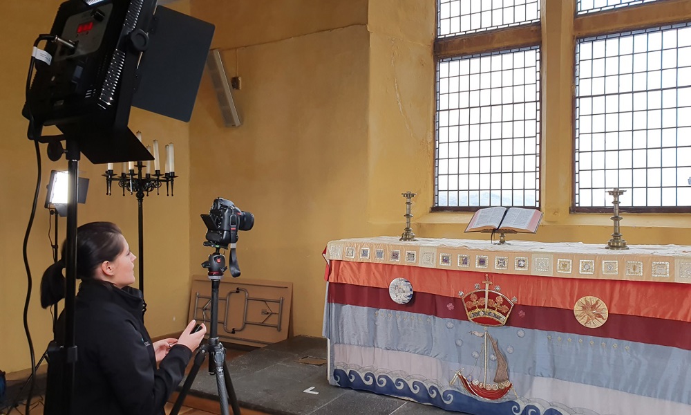 A person using photography equipment to scan a table and objects inside Stirling Castle