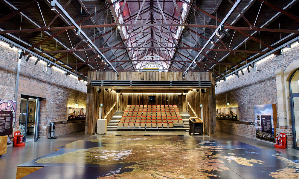 The main space inside the Engine Shed, with a giant map of Scotland on the floor and a large auditorium with an open front