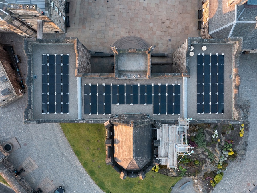 A birds eye view of solar panels on the flat roof of the National War Memorial at Edinburgh Castle